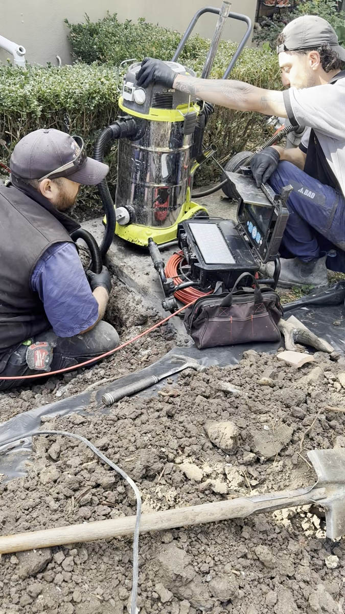 The team clearing a blocked drain with CCTV equipment